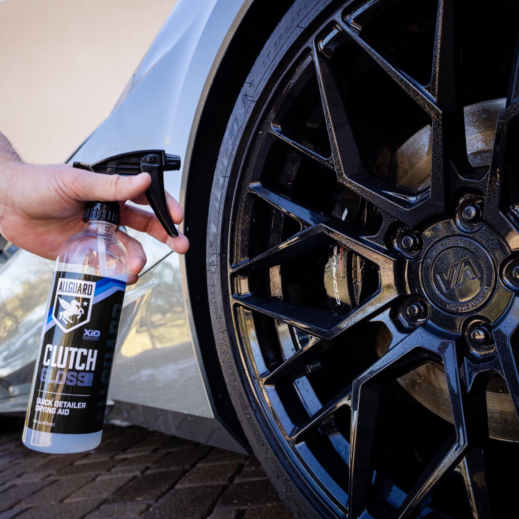 Quick exterior car detailer showcased near black rims