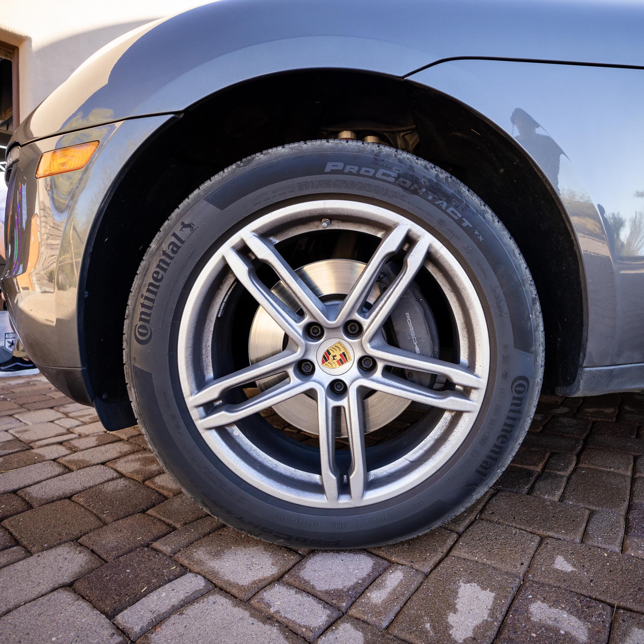 Shiny rim and front of Porsche after being detailed with ALLGUARD products