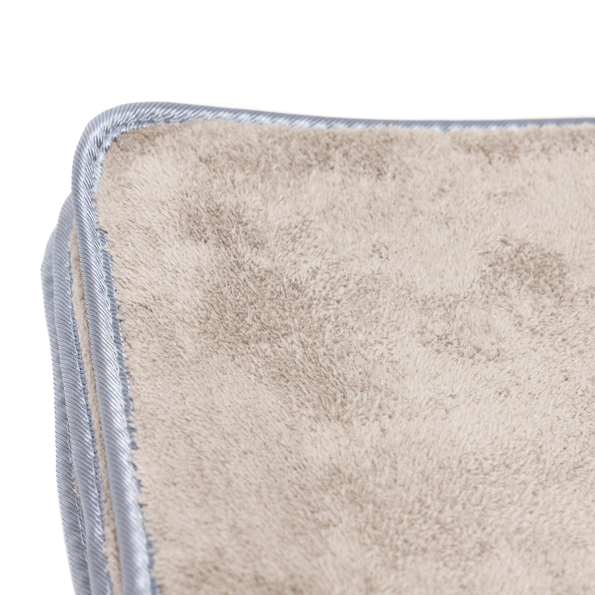 Corner of off white microfiber towel after use