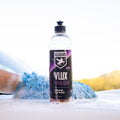 VLUX Wash in front of sudsy car wash mitt