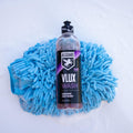 VLUX wash ceramic car wash resting on blue wash mitt